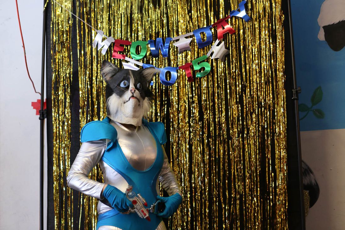 Space Cat dutifully performed for hours, dancing to a DJ set and posing for photos with event-goers.<br/>